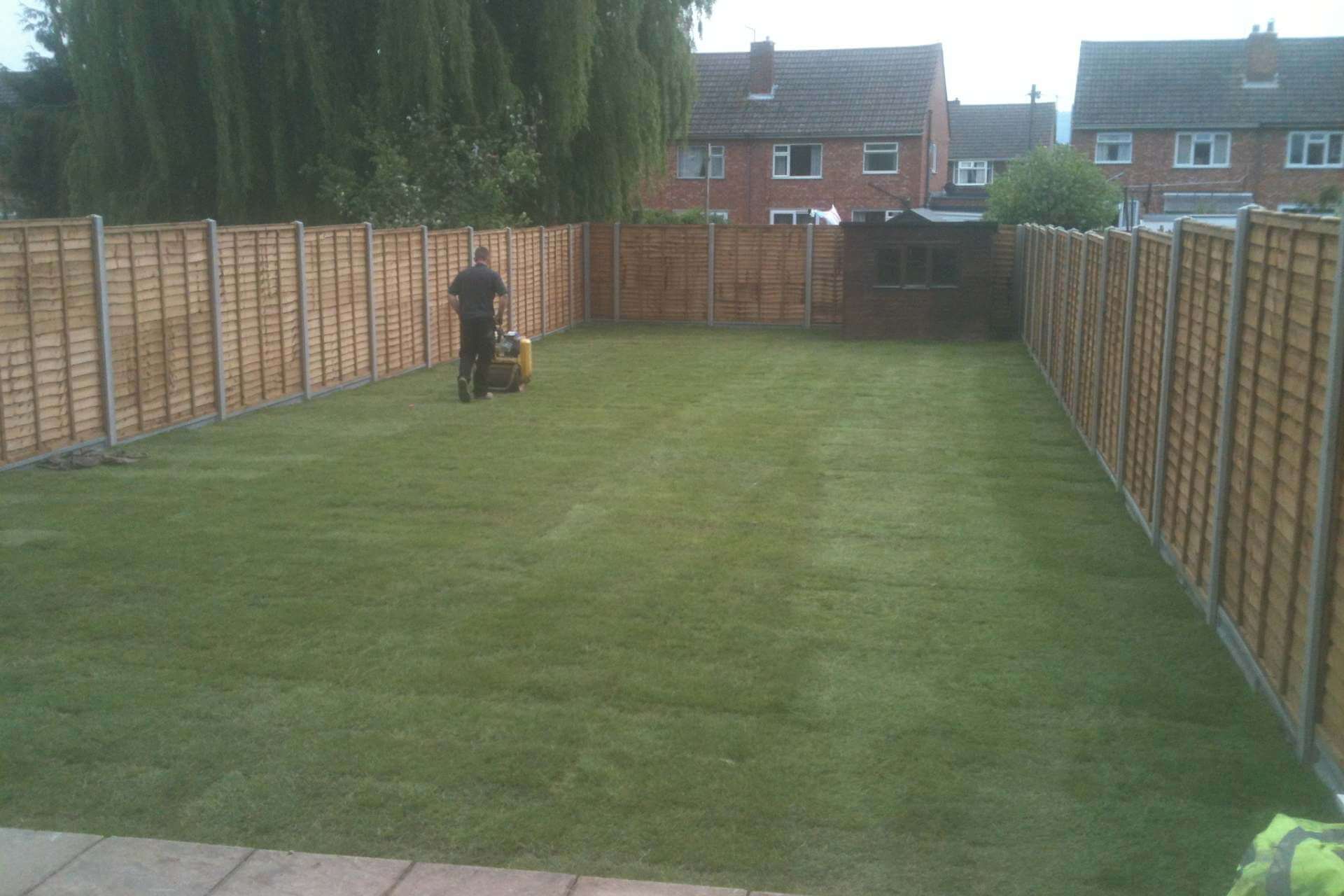 K Collier crew compacting a new lawn