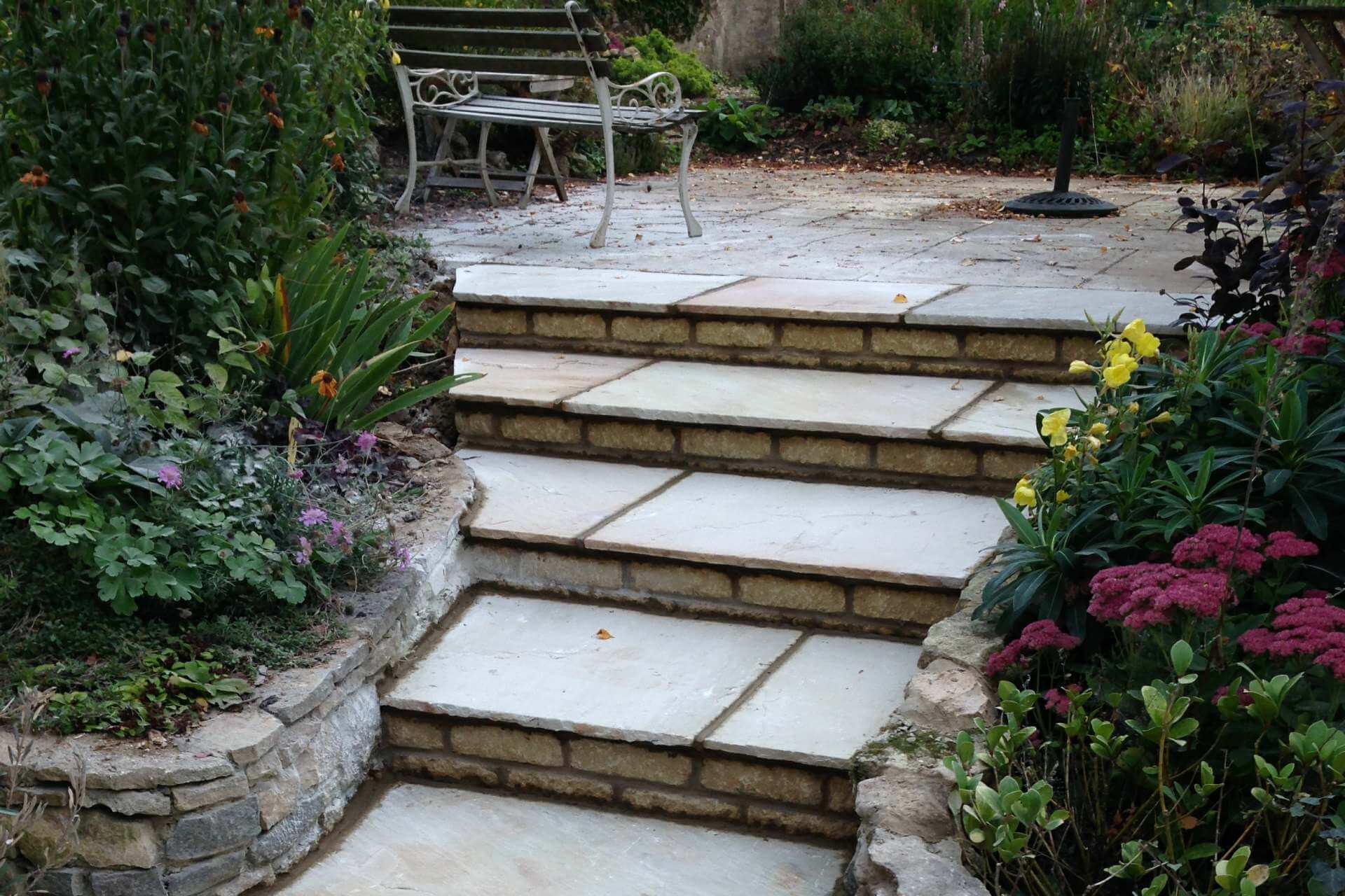 Sandstone steps into a planted garden
